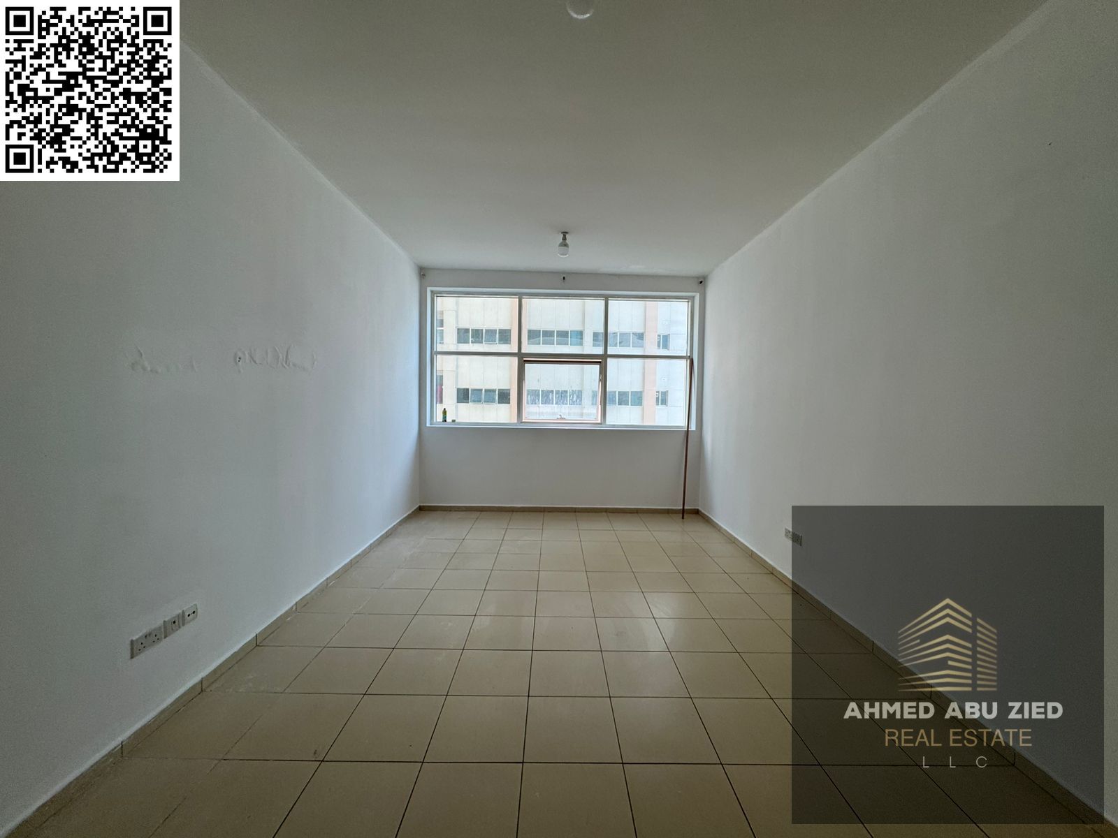 Modern studio for annual rent in Ajman One Towers, semi-closed kitchen, built-in wardrobes, garden view, prime location, and great value