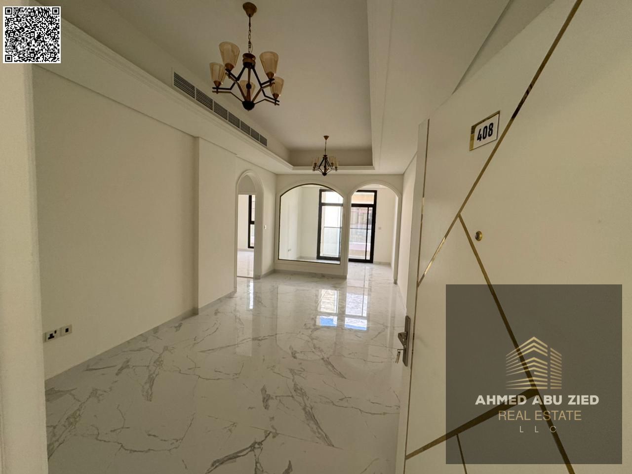 A brand-new 2BR apartment in Al Tallah (Ajman): 3 baths, central AC, balcony, built-in wardrobes, hotel-finish, spacious, prime location.