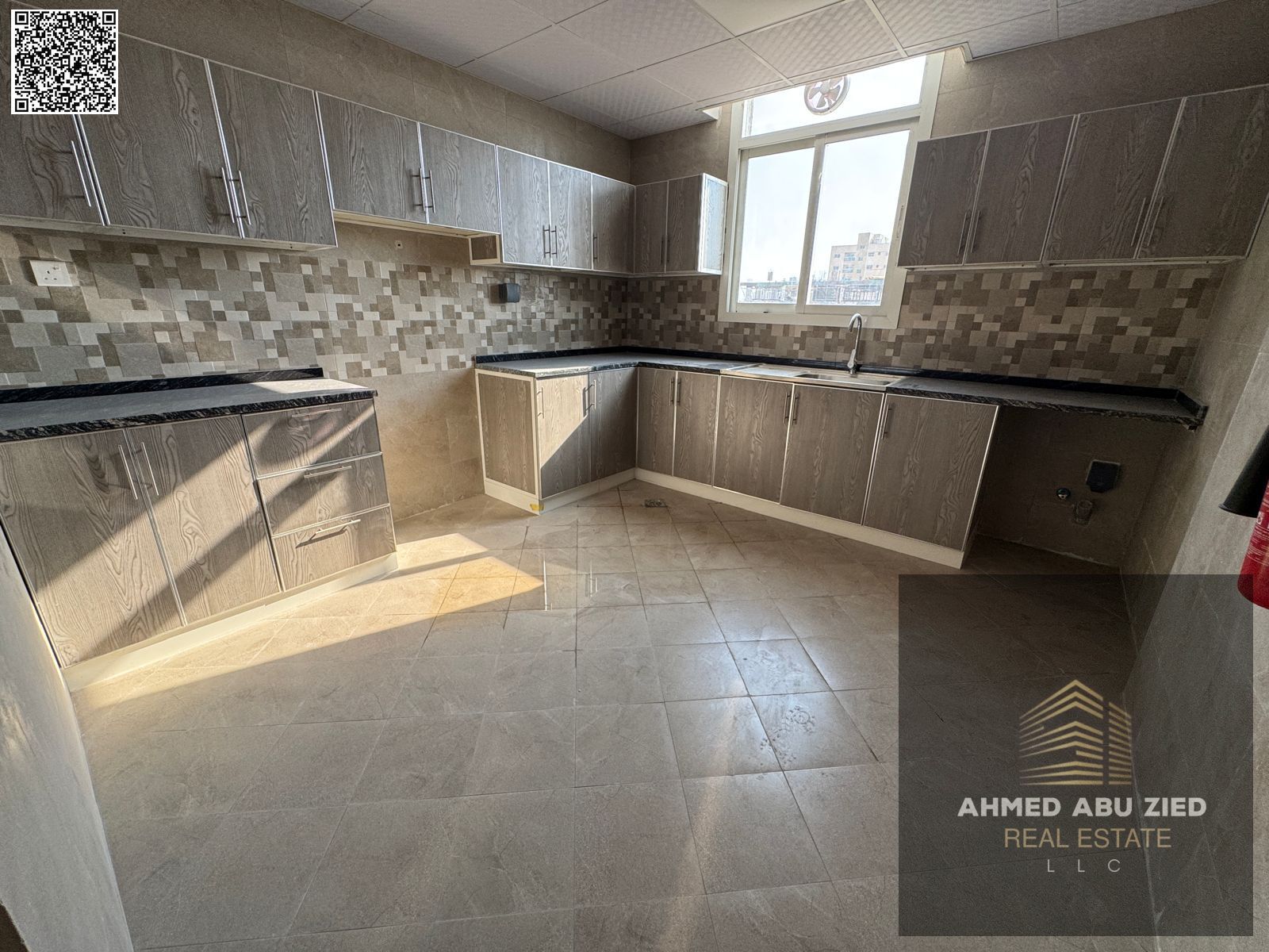 Brand-new 2BR in Al Jurf 3: living room, maid’s room, free month, 3 baths, balcony, built-ins, central AC, hotel finish, prime loction