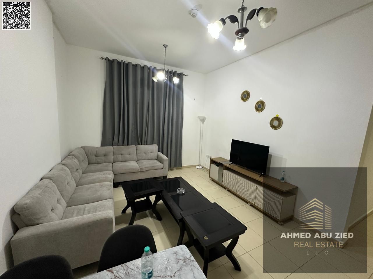 Annual rent: furnished 2BR in Al Nuaimiya 3 with clean décor, spacious layout, quality finish, balcony, 2 baths, central AC, prime location near Dubai