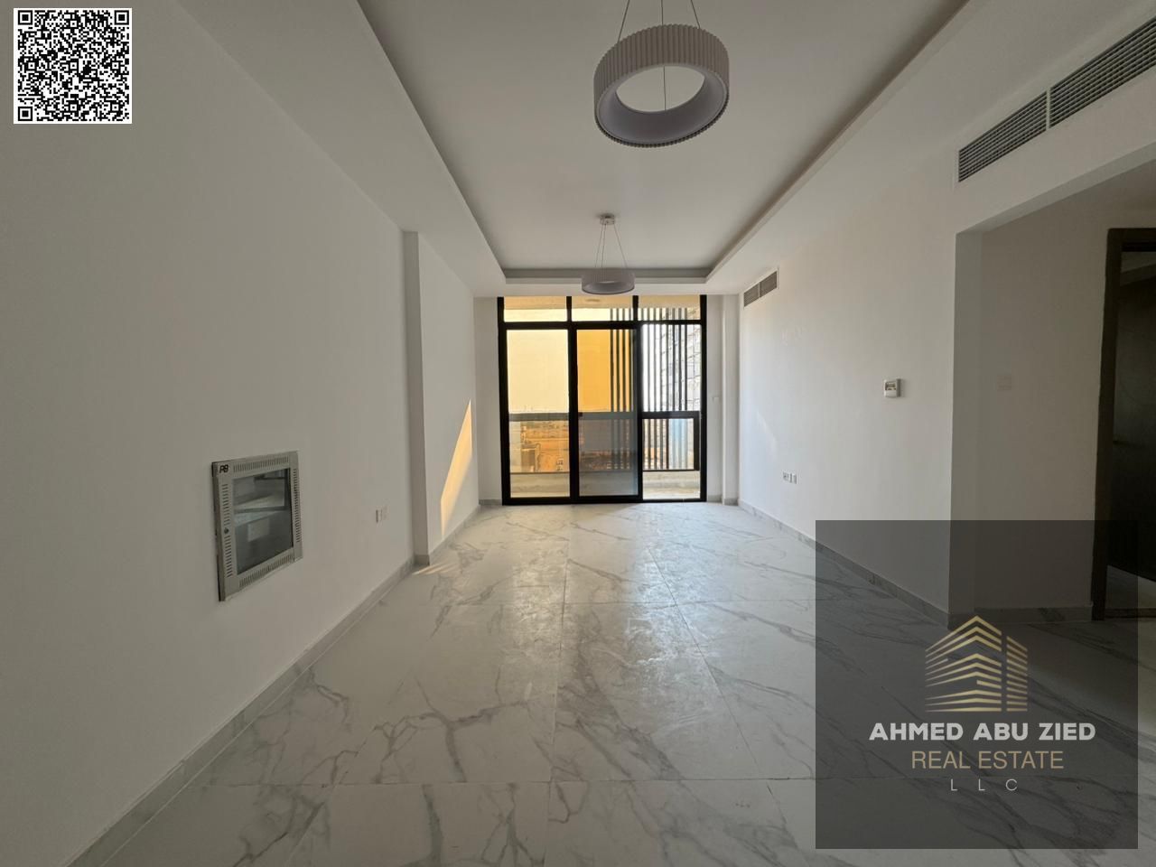 Annual rent: finest 2BR apartment with hall, first tenant in Al Jurf 3 – free parking, 1 month free, central AC, balcony, easy payment plan, prime loc