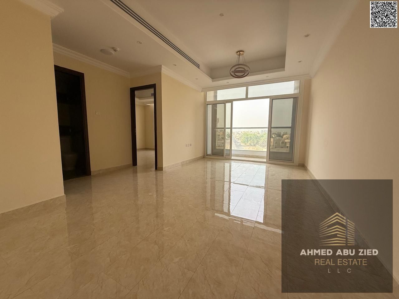 A 2BR apartment in Al Rawda 2 with free parking: hotel-finish, spacious, prime location near Exit 311, balcony, central AC, 2 baths.