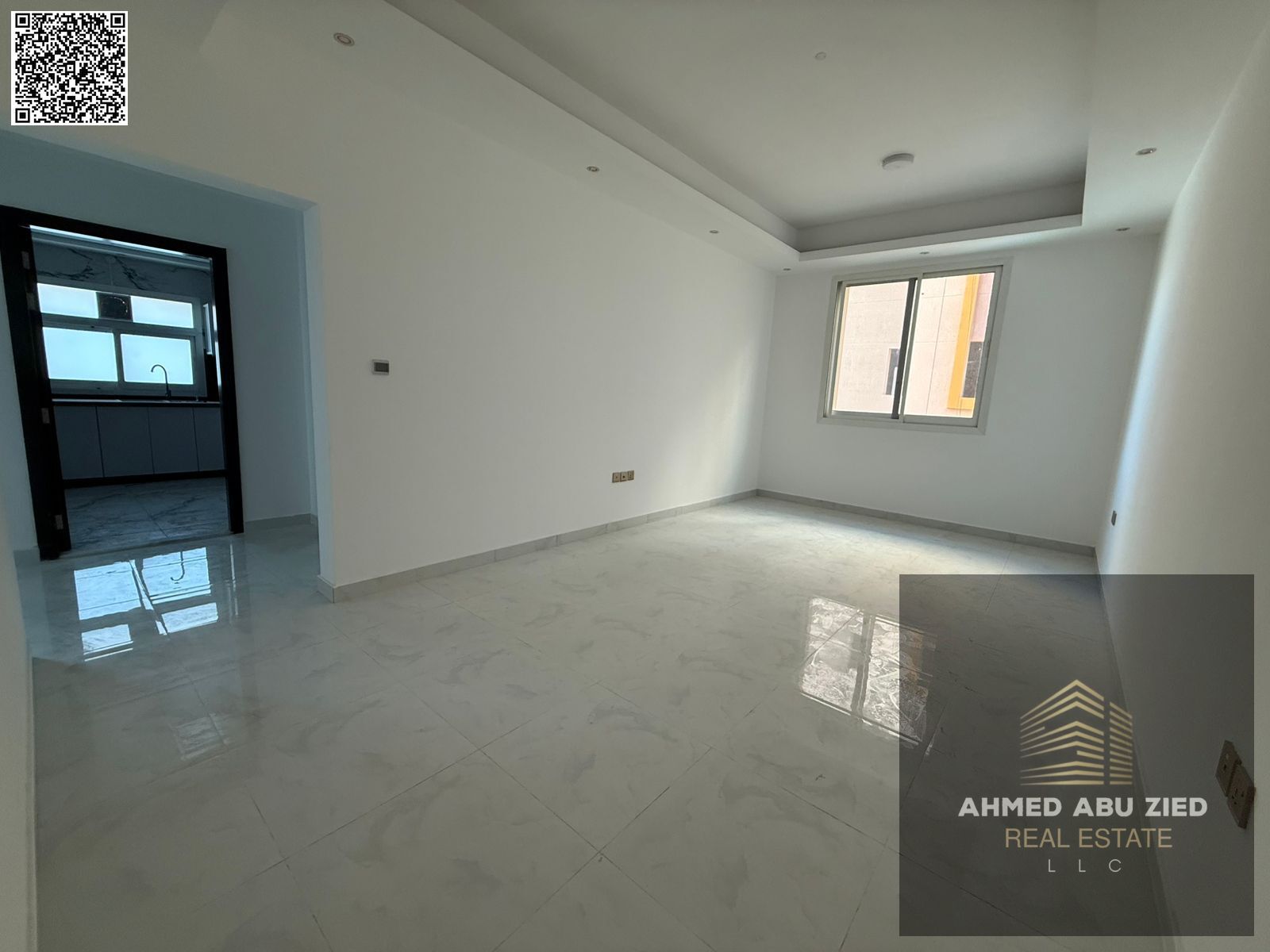2BR + hall for annual rent in Al Mowaihat 3. Brand-new building, first tenant, 1 month free, 3 baths, balcony, central AC, modern finish.