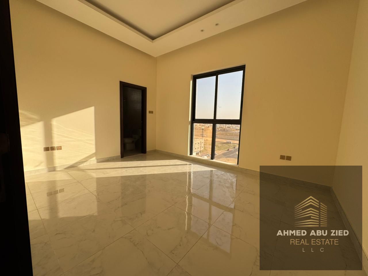 2BR apartment, first tenant, annual rent in Al Jurf. 1 month free, 2 master rooms, balcony, central AC, 3 baths, great view, spacious.
