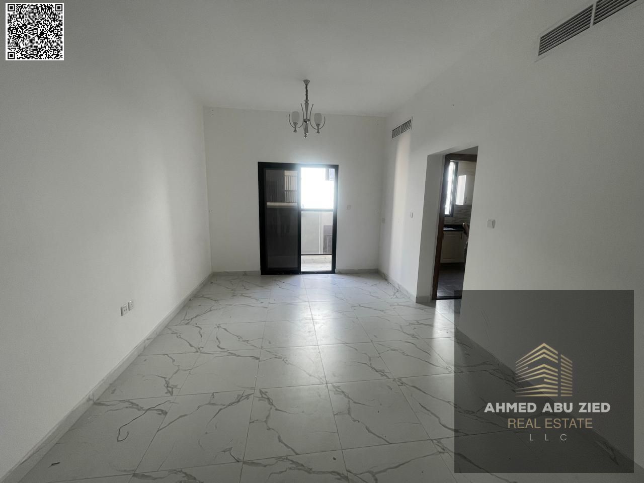 Annual rent: 1BR+hall in Al Alia, prime spot, easy Dubai exit, new bldg first tenant, master bed, 2 baths, central AC, balcony, great finish.