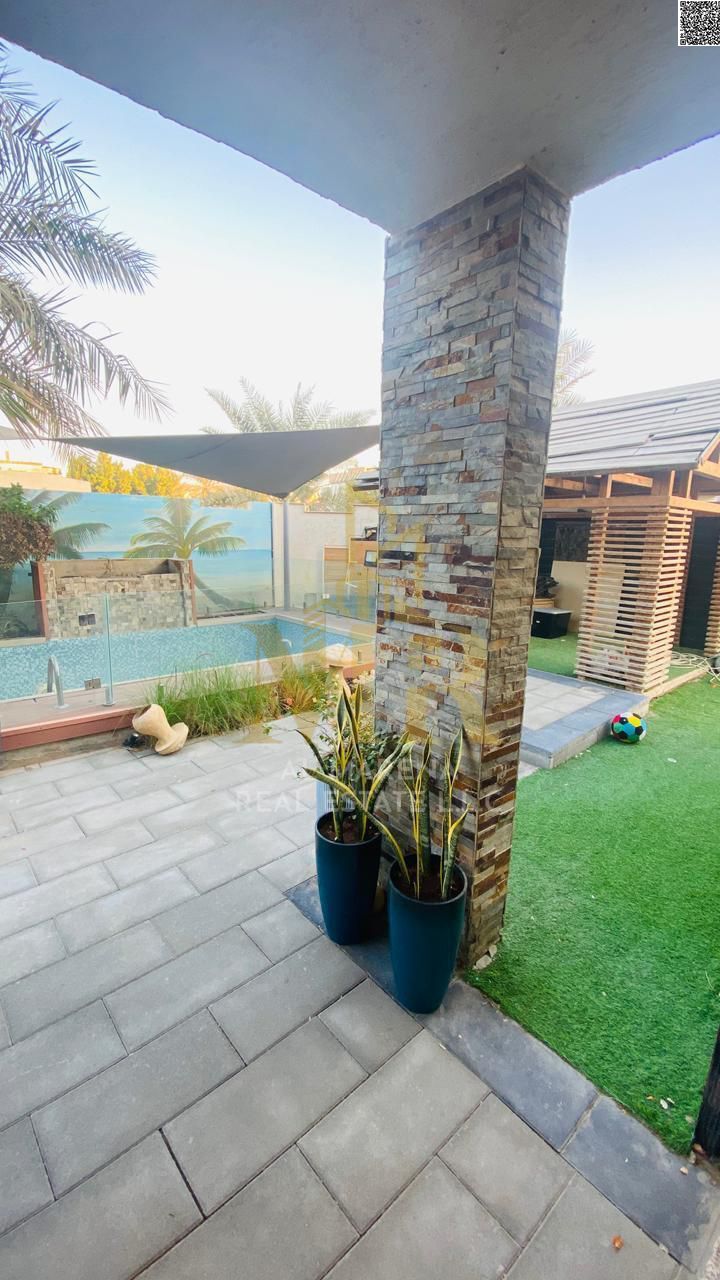 Luxury corner villa for sale – Al Rawda 3, Ajman – with swimming pool, price includes electricity, water, and air conditioning. Freehold ownership.