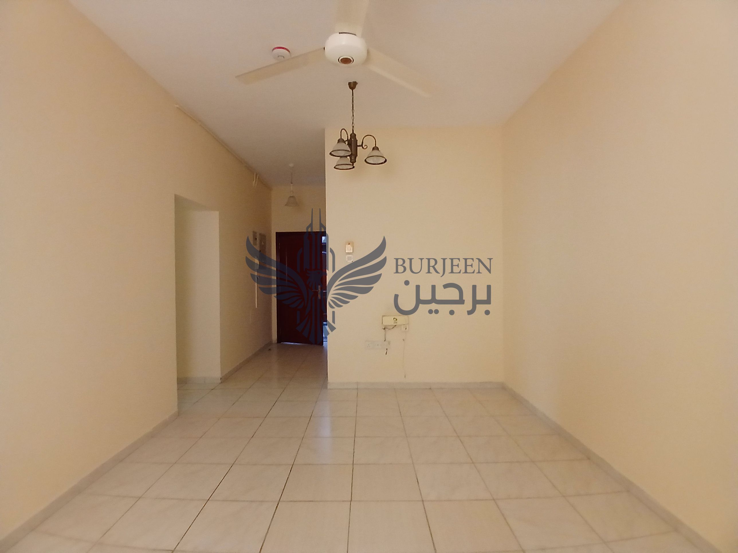 Spacious 2bhk apartment available in window ac central gas family building with balcony in al guwair