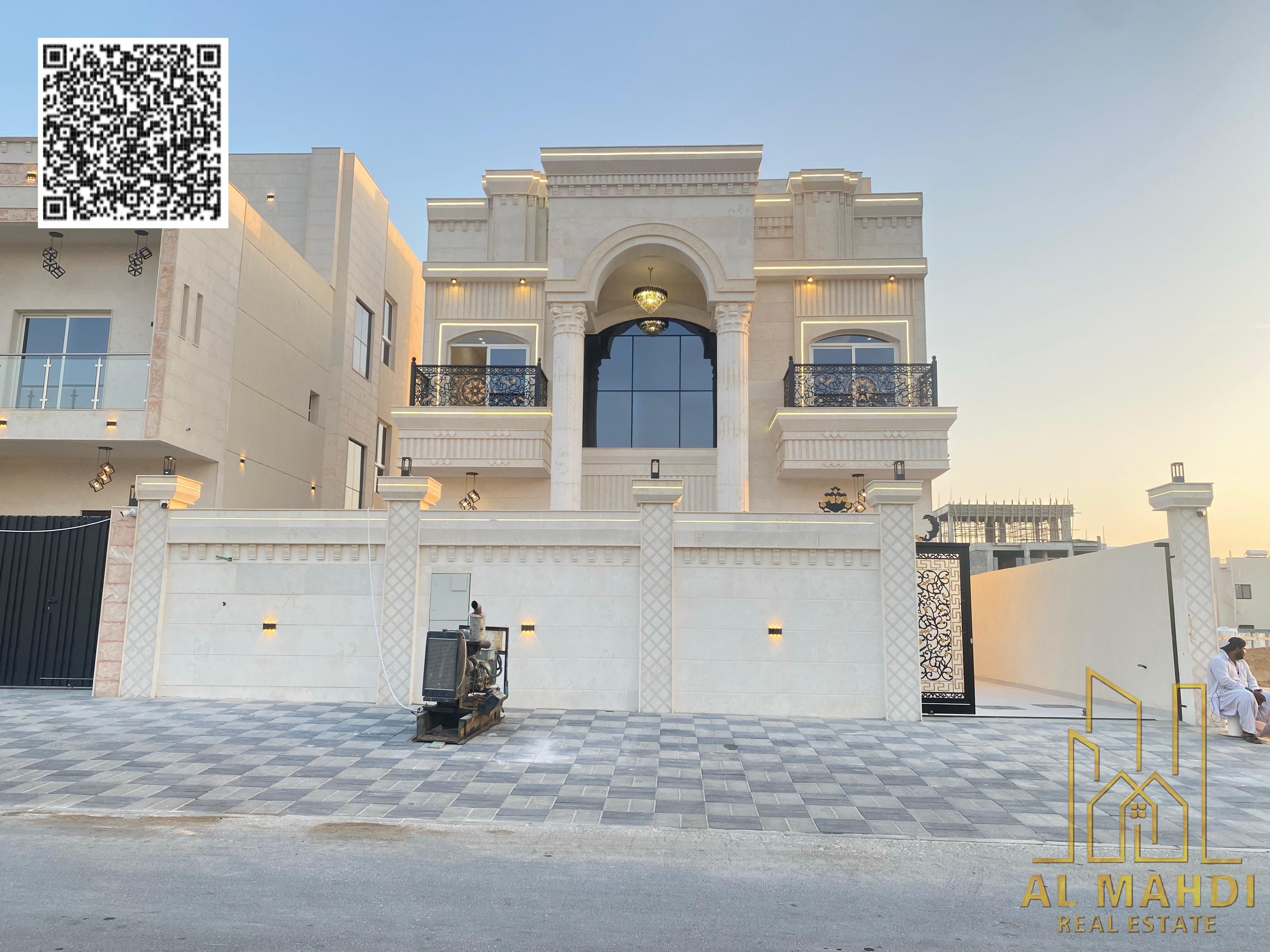 A luxurious classic villa for sale in Al Helio 2, Ajman, situated in a prime location on a main street.