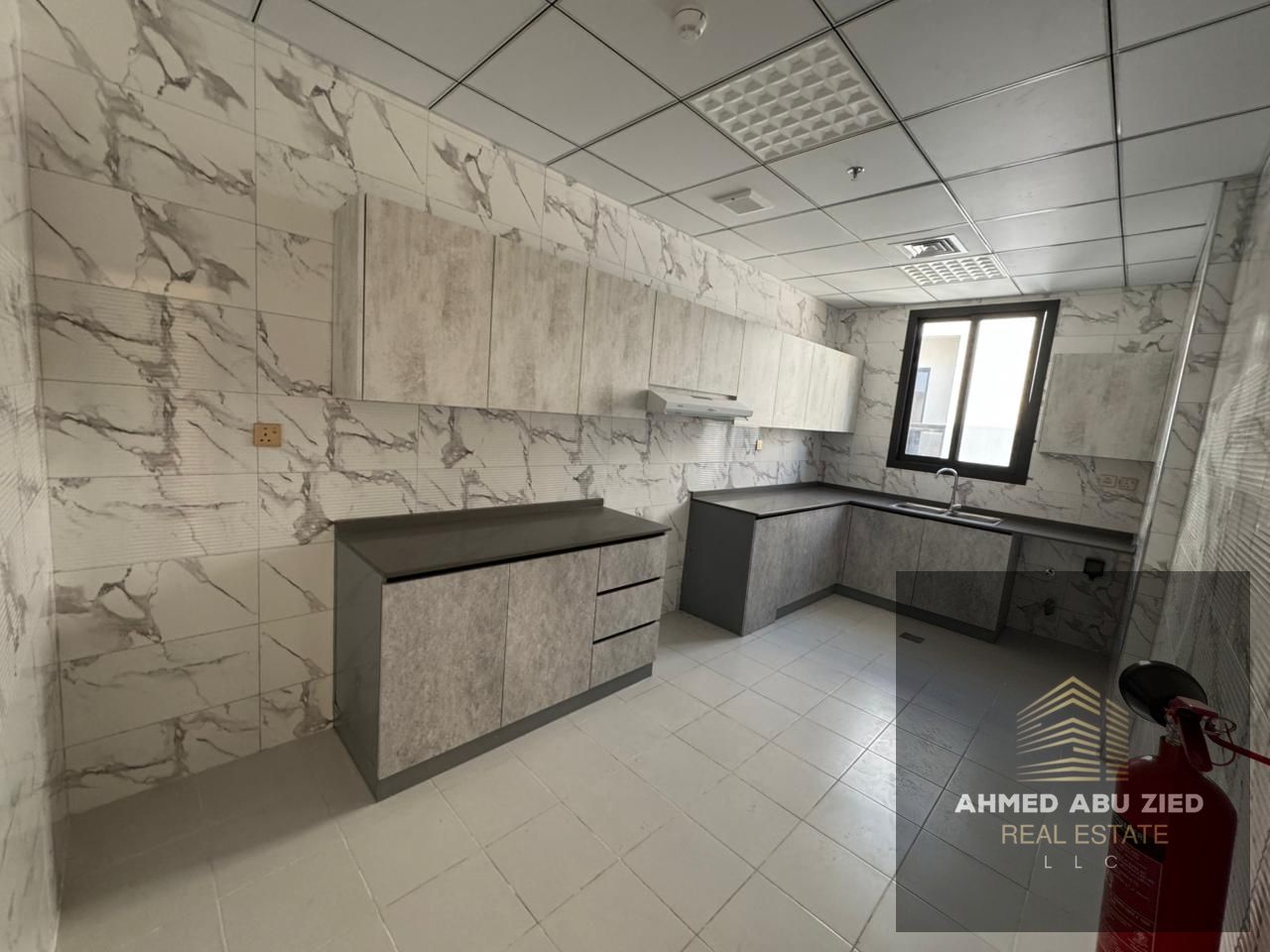 Brand-new 2BR apartment in Al Jurf, 1 month free, 2 master rooms, 3 baths, central AC, balcony, high-end finish, spacious,