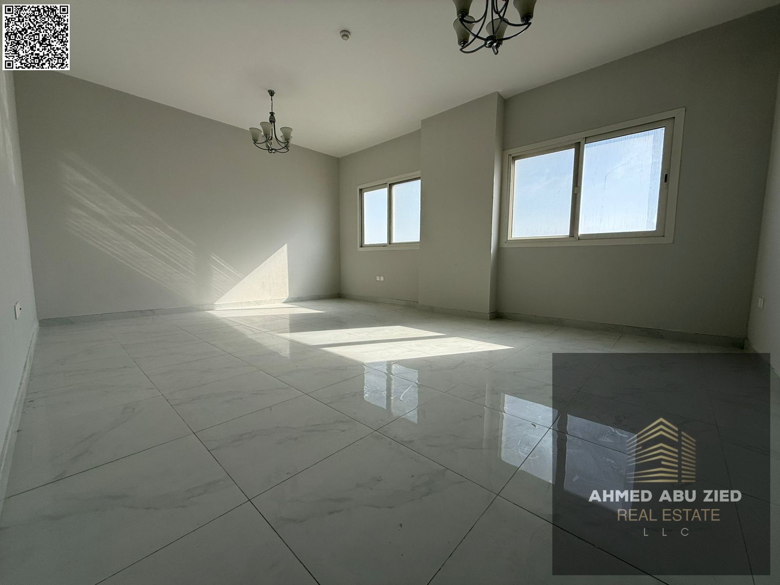 2BR apartment with private parking in Al Jurf, Ajman, 2 master rooms, 3 baths, central AC, balcony, premium finish, easy Dubai access.