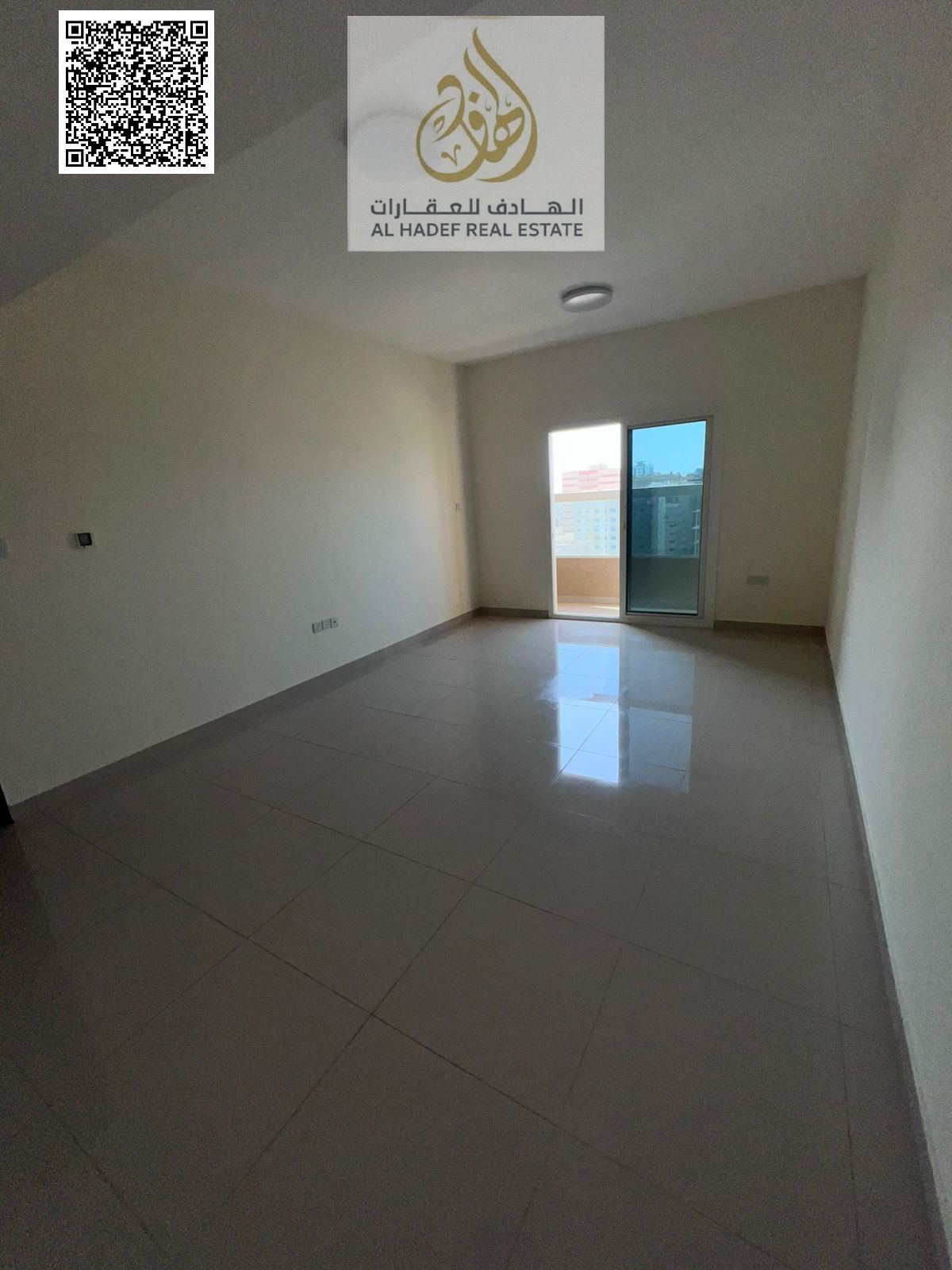 A detached one-bedroom apartment with a living room, two bathrooms, a balcony, built-in wardrobes, and central gas, in a prime location in Al Nuaimiya