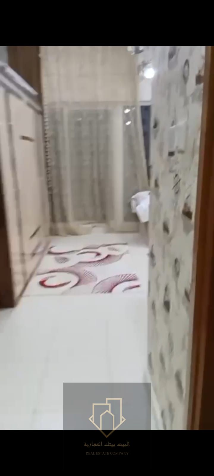 Two-bedroom apartment with a living room in Ajman One Towers, high floor with a full city view, large area of 1,990 sq. ft. , balcony, closed kitchen,