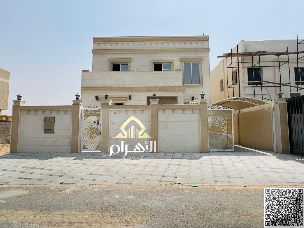 Two-story villa at an attractive price, 4 master bedrooms, prime location off Sheikh Mohammed Bin Zayed Road, freehold ownership for all nationalities