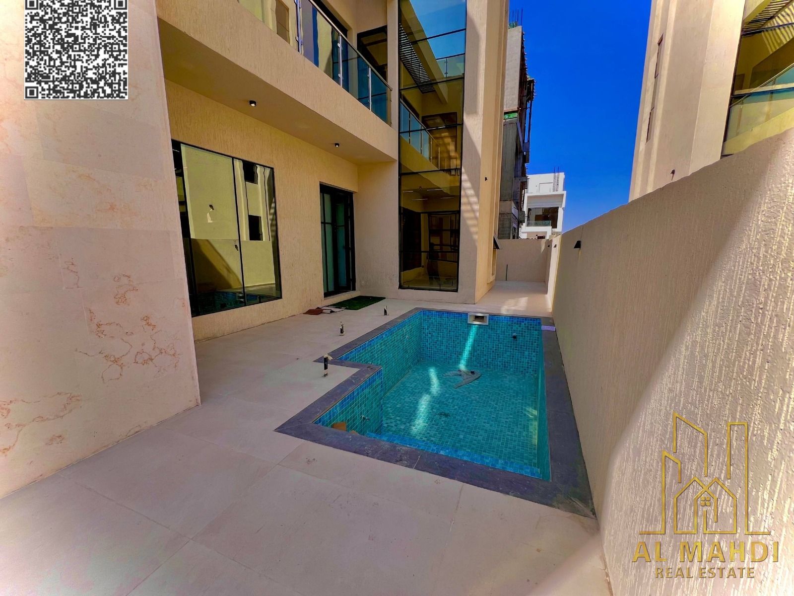 5-bedroom villa with swimming pool, roof terrace and maid's room for sale in Al Yasmeen area - Ajman. Luxurious design and prime location.