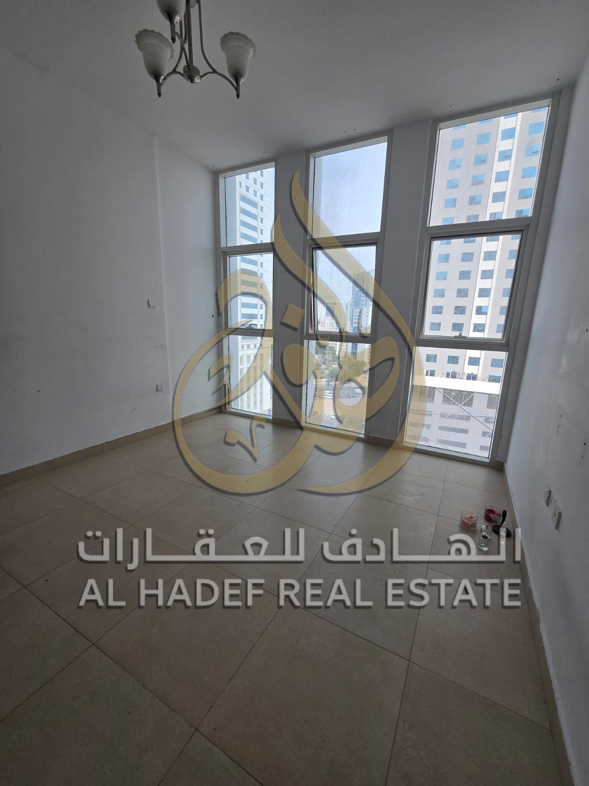 3BR apartment with living room, maid & laundry room, large balcony, built-in closets, free parking, located in Al Taawun area.