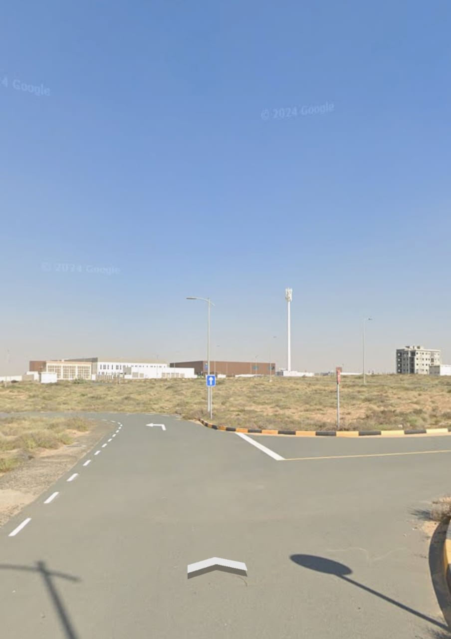Two adjacent residential/commercial plots for sale in Al Tay Commercial Area, Al Suyoh District, Sharjah.