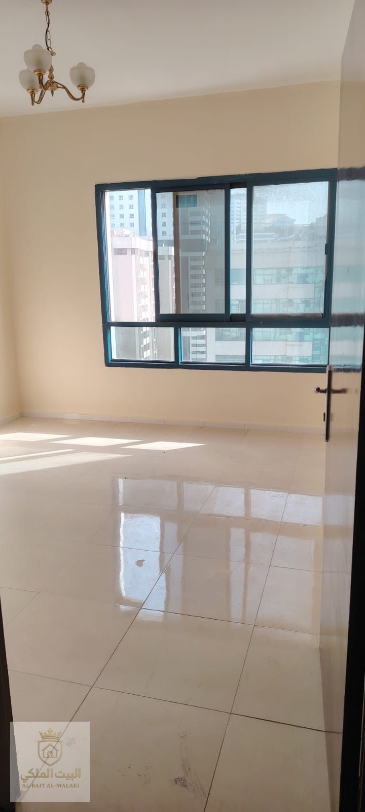Three-bedroom apartment with a living room for annual rent in Al Majaz 3, prime location and excellent condition.