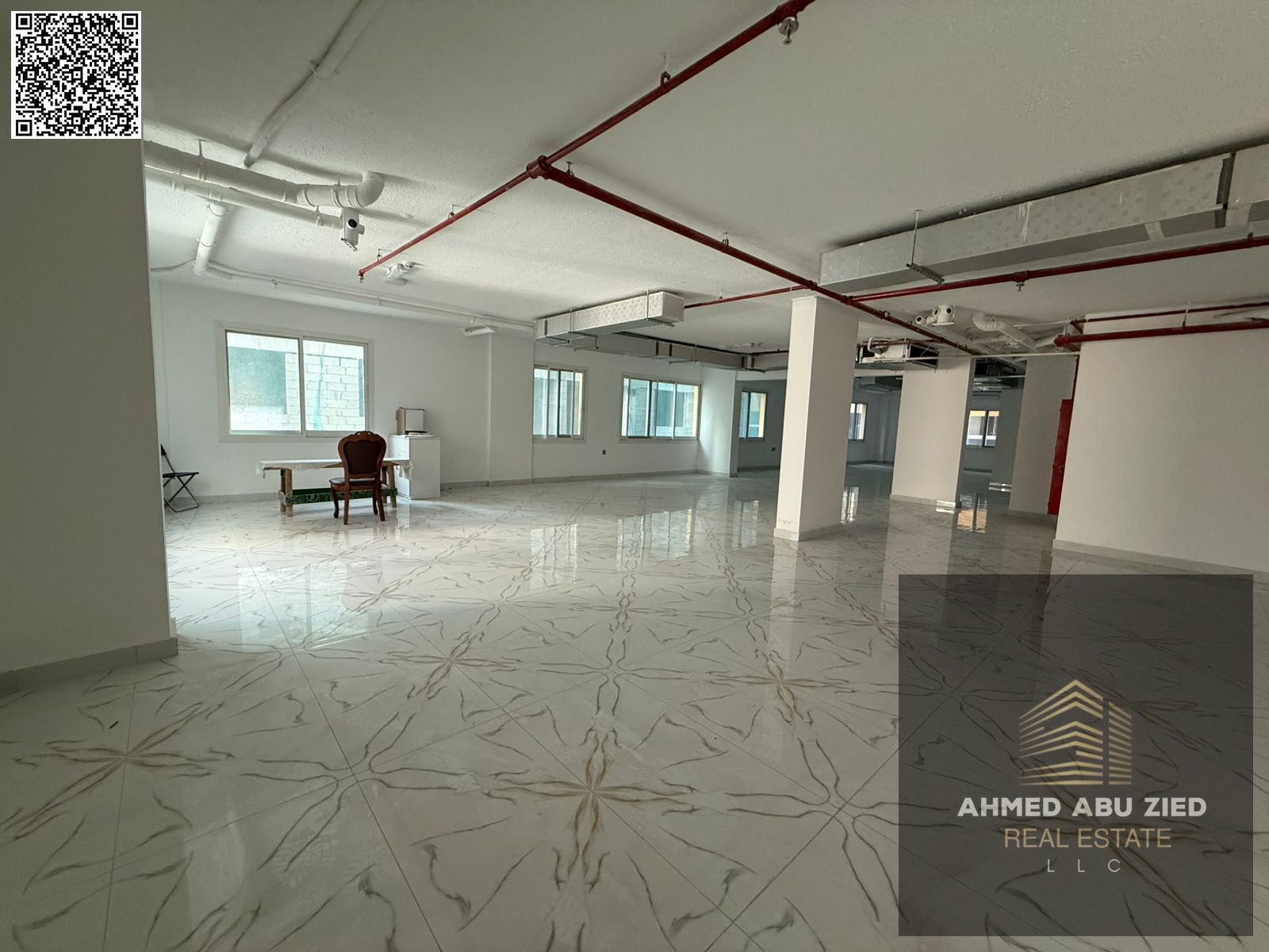 Commercial floor for annual rent in Al Mowaihat, 2500 sqft, 1 month free, 2 baths, easy payments, prime location, ideal for investment.