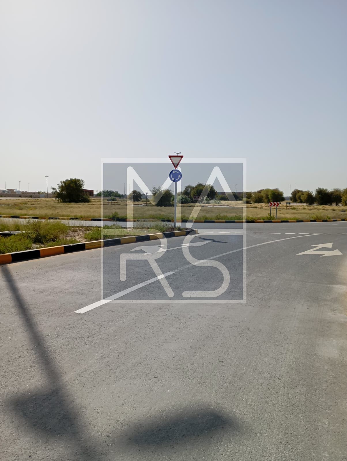 **Land for Rent in Al Saja’a – Fenced Plot with Office**