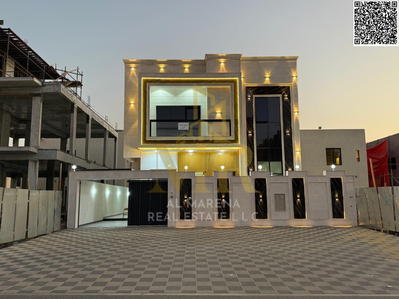Villa for sale in Al Amerah on a 3,014 sqft land plot, featuring 5 master bedrooms, a majlis, and a spacious living hall. The property combines comfor