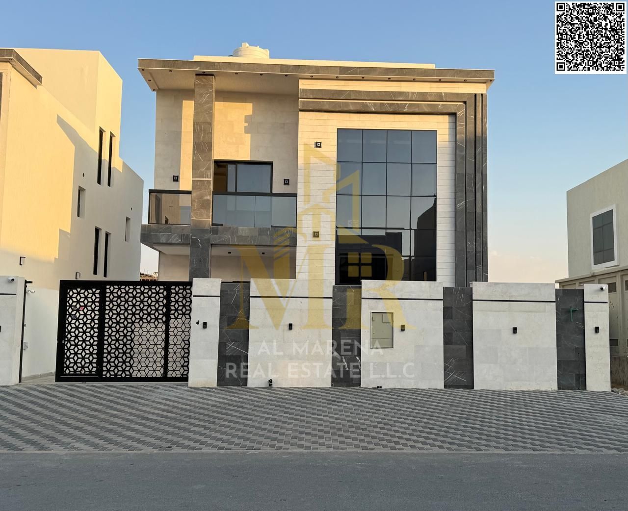 Luxury villa for sale in Al Amerah on a 3,014 sqft land plot, featuring 5 master bedrooms, a majlis, spacious living hall, and a fully equipped modern
