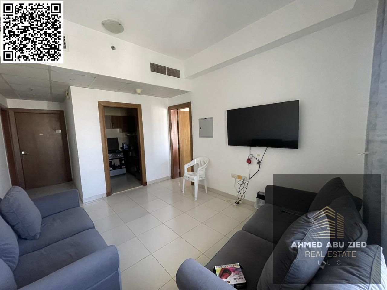 Upscale furnished one-bedroom apartment for annual rent in Al Amrah, Ajman | Balcony with open view | 2 bathrooms | Central air conditioning | Close t