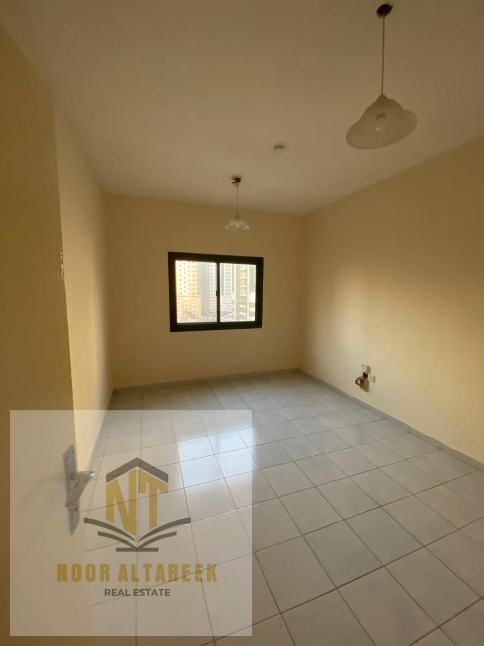 Spacious apartment available for rent in Al Nahda, located in a lively and convenient area close to supermarkets, restaurants, schools, and public tra