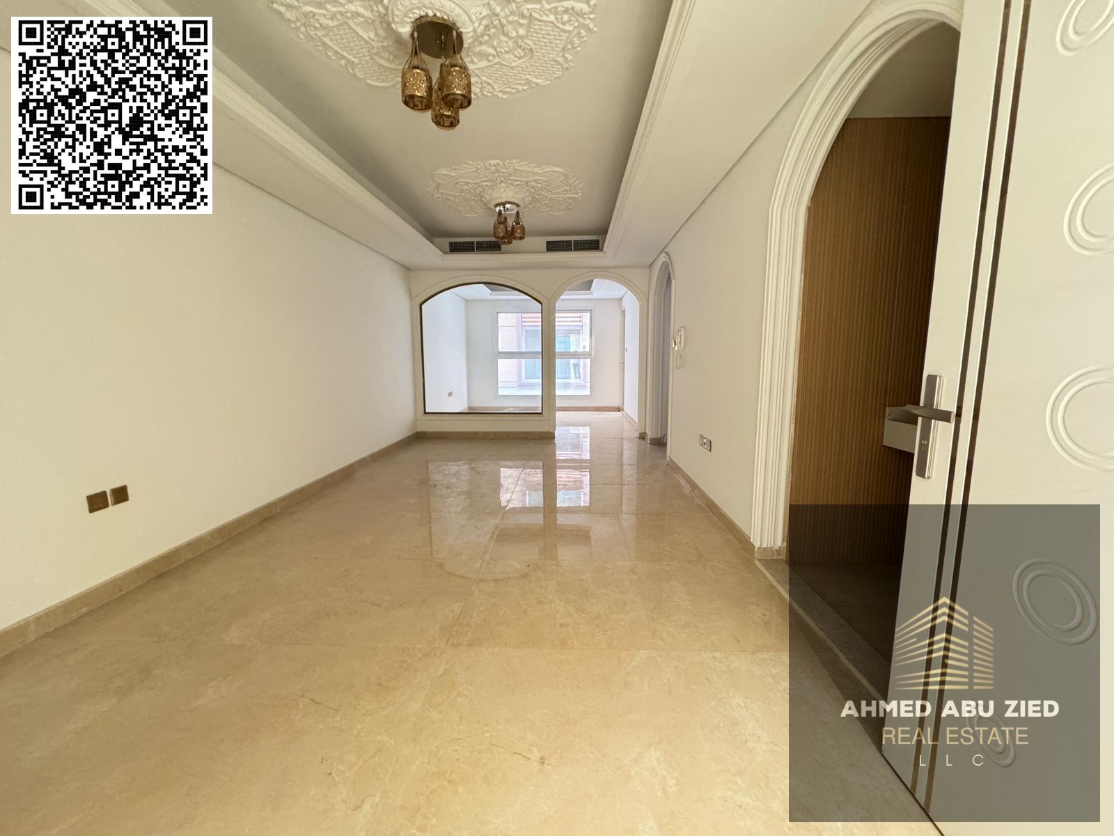 For annual rent in Ajman, a one-bedroom apartment with a living room, two bathrooms, a balcony with an open view, a very spacious layout, central air