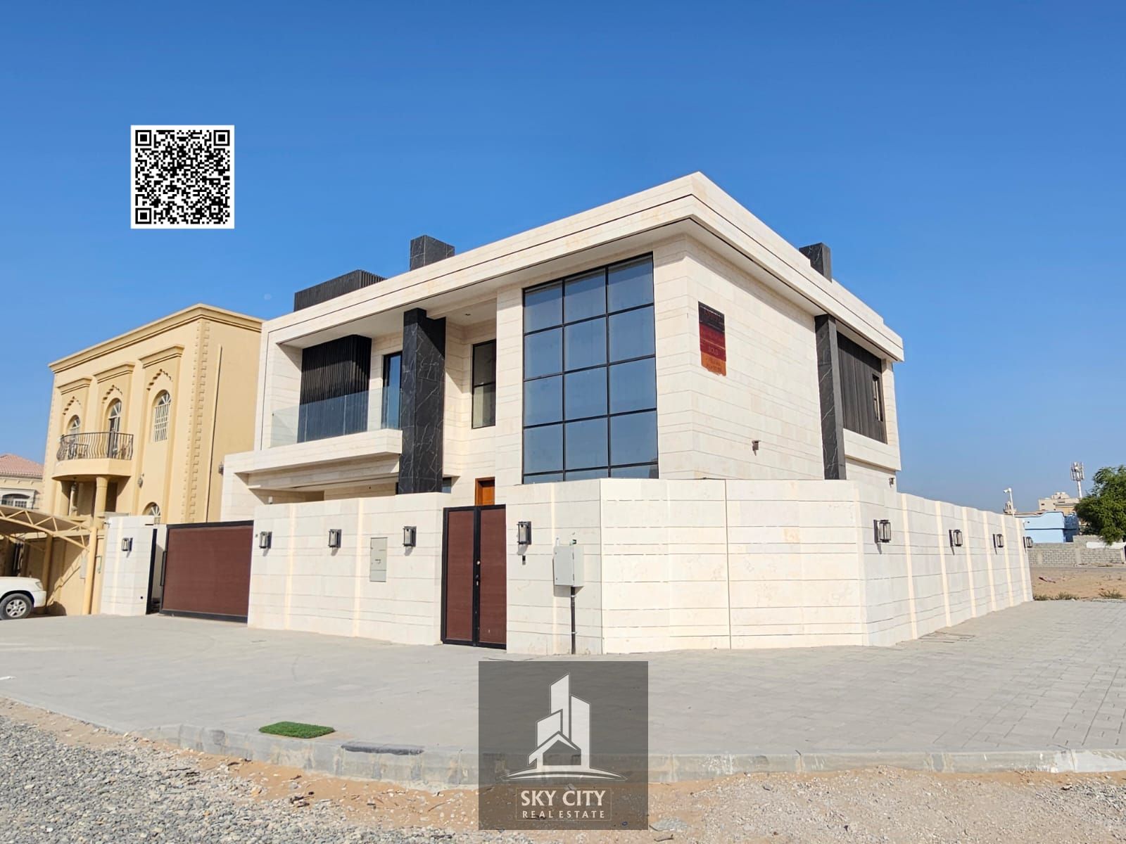 A luxurious villa with an elegant architectural design that blends modern sophistication with classic touches, located in a tranquil area offering its