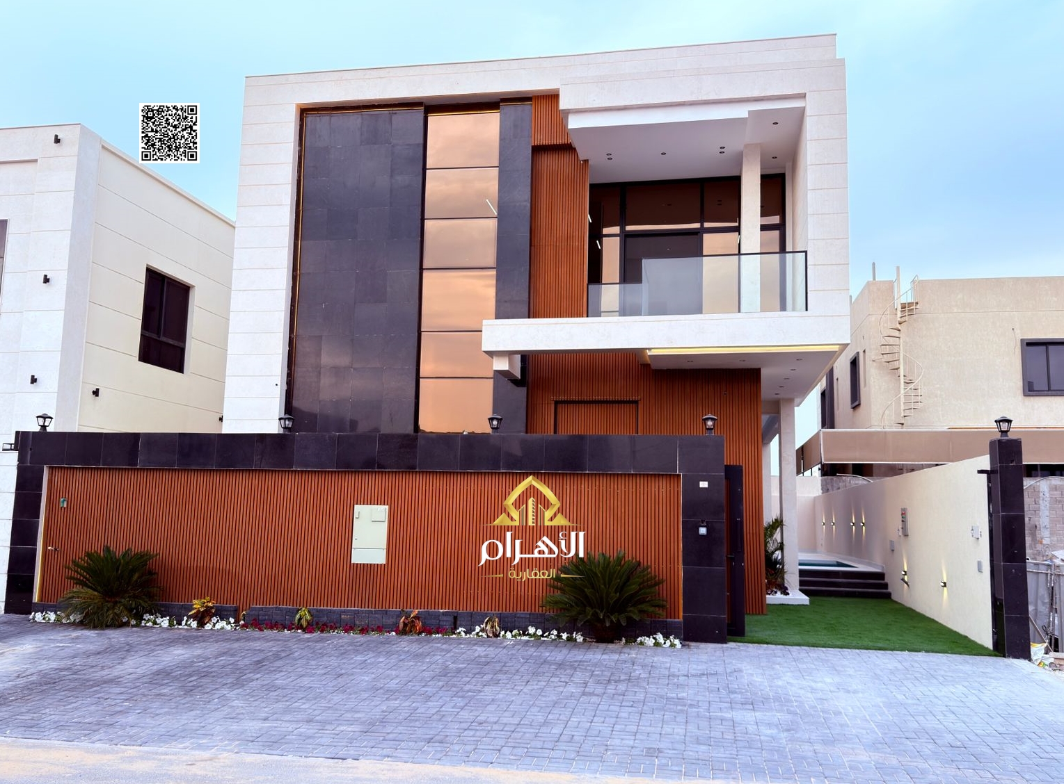 Luxury villa for sale in Al Bahia area, featuring two floors and a rooftop terrace. Modern design, spacious living areas, reception halls, and compreh