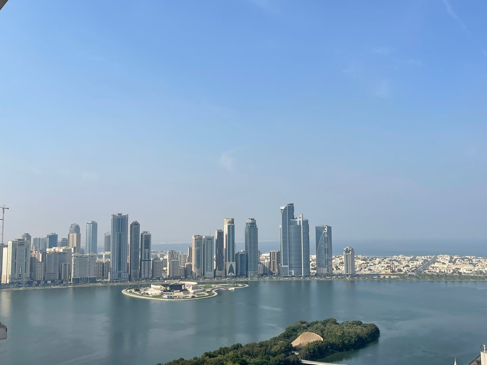 Balcony with open sea view | Free AC, parking, gym & pool | Prime location | Easy access to Dubai entrance