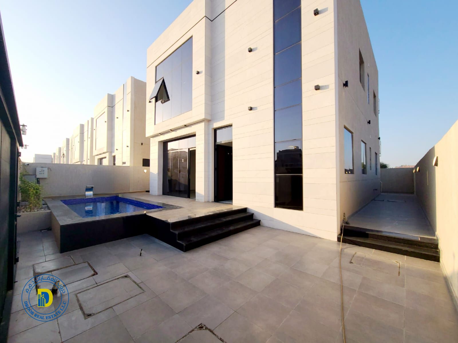 Al Helio 2, Ajman, a 4BR villa with pool, including registration fees, bank financing, and freehold ownership for all nationalities.