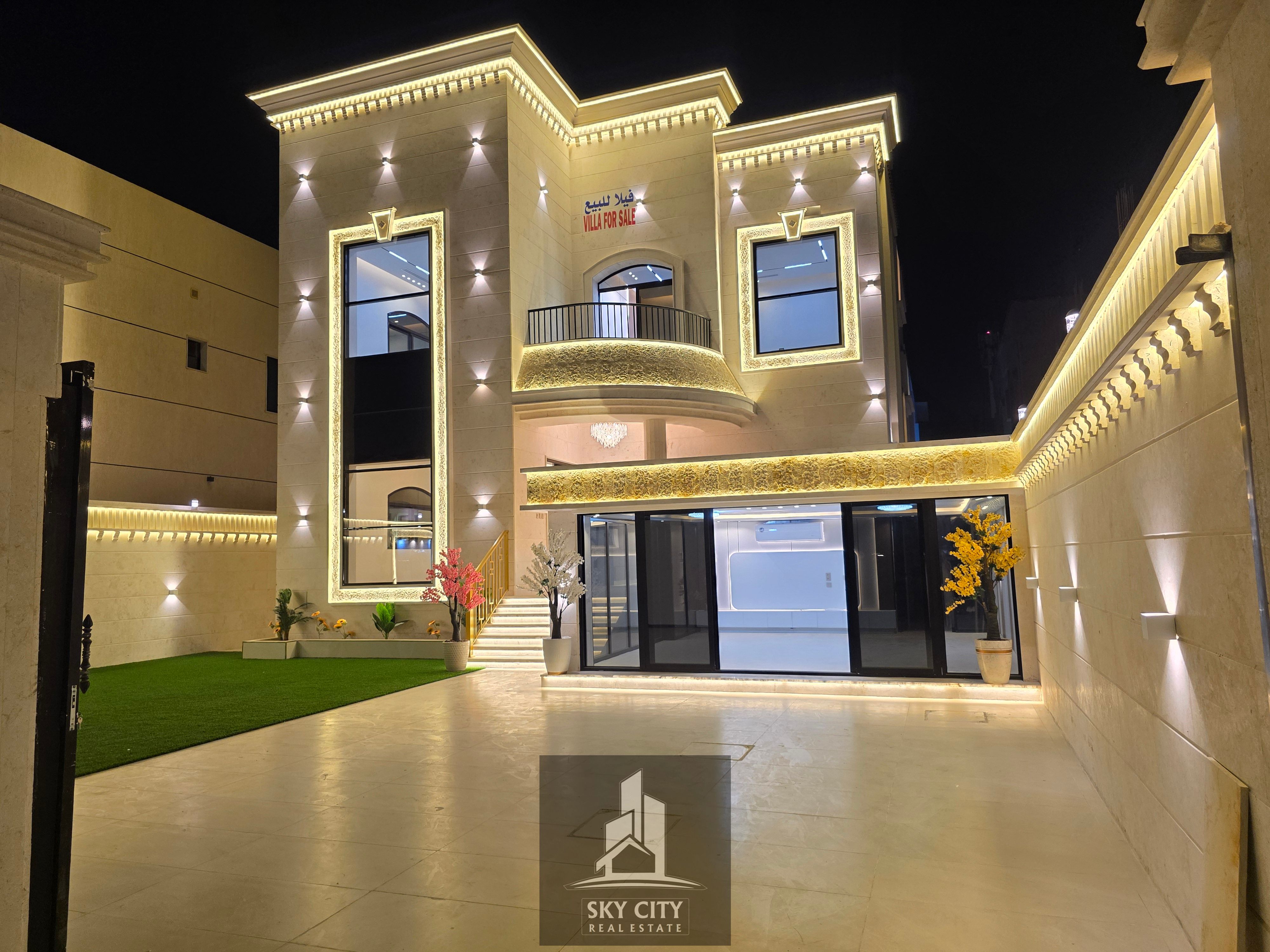 For sale in Ajman, Al Muwaihat 1, behind Nesto Al Tallah, near Sheikh Ammar Street and the Saudi German Hospital. 5000 sq ft, paved road, ready to move in, with electricity, water, and central air conditioning. Ground floor, first floor, and roof with an