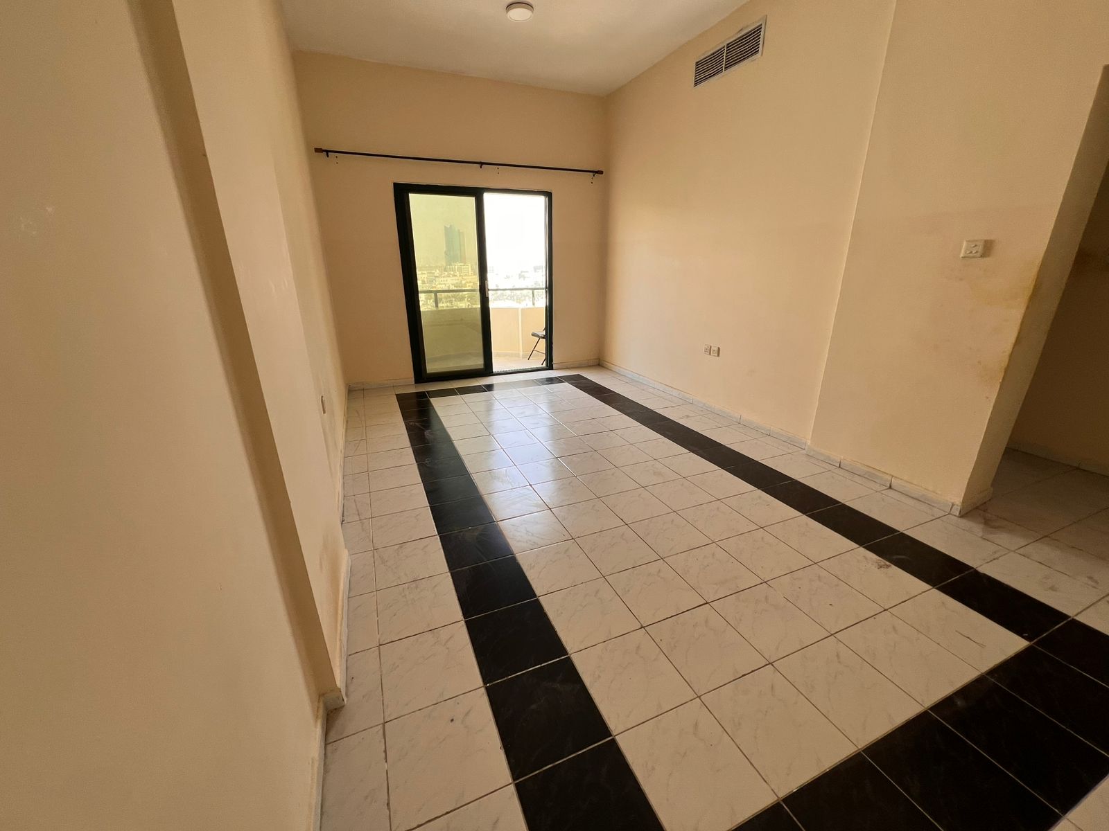 One bedroom and hall with balcony, spacious layout, prime and lively location close to cafes, malls, and near Dubai exit.