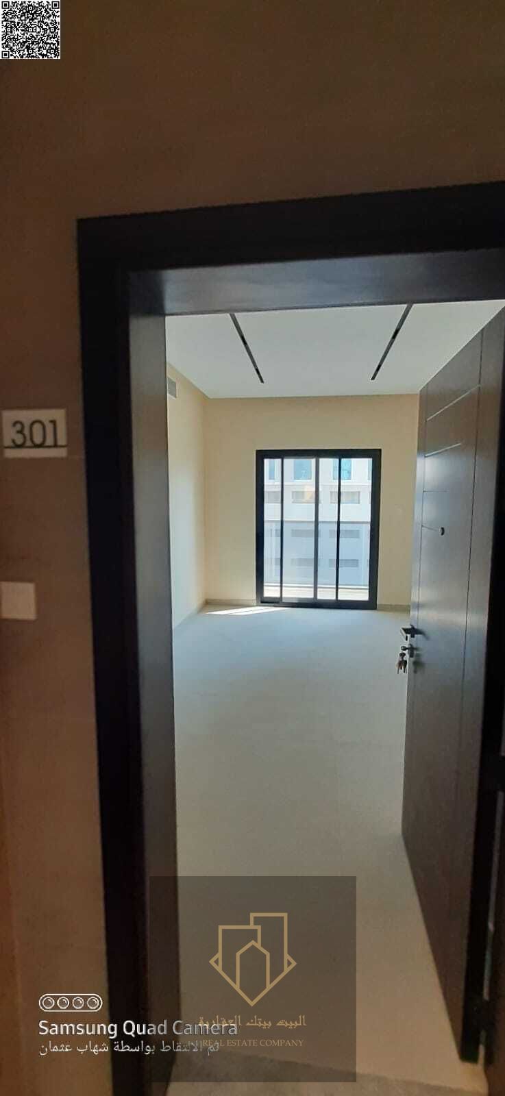 Two-bedroom apartment with a living room, first tenant, two bathrooms, and a balcony. Super deluxe finishing. Prime location with easy access to Sharj