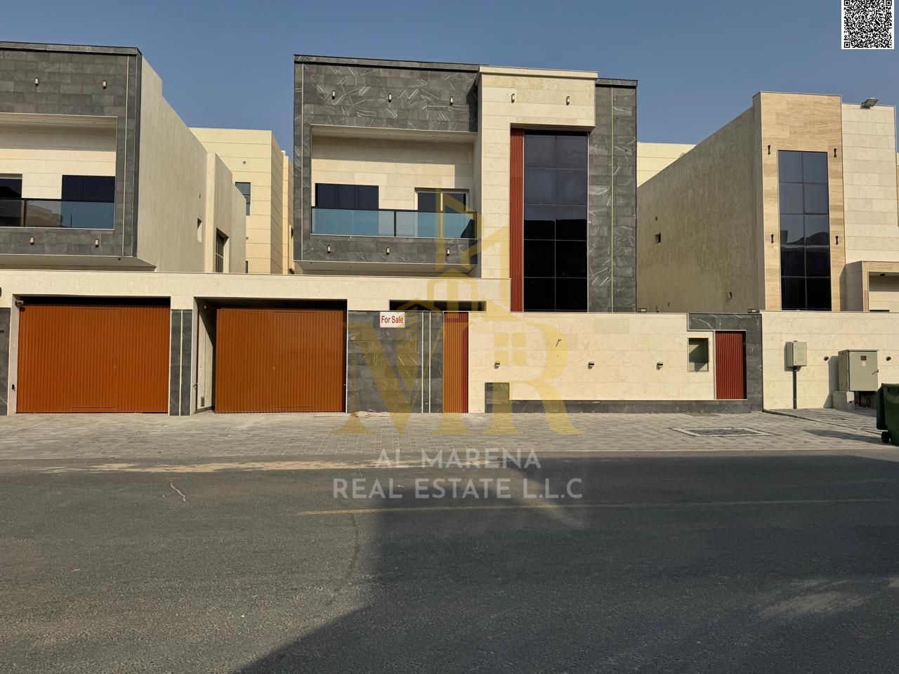 Luxury villa for sale in Al Amrah area - Ajman | Central air conditioning, modern design and luxurious specifications. Take advantage of the opportuni