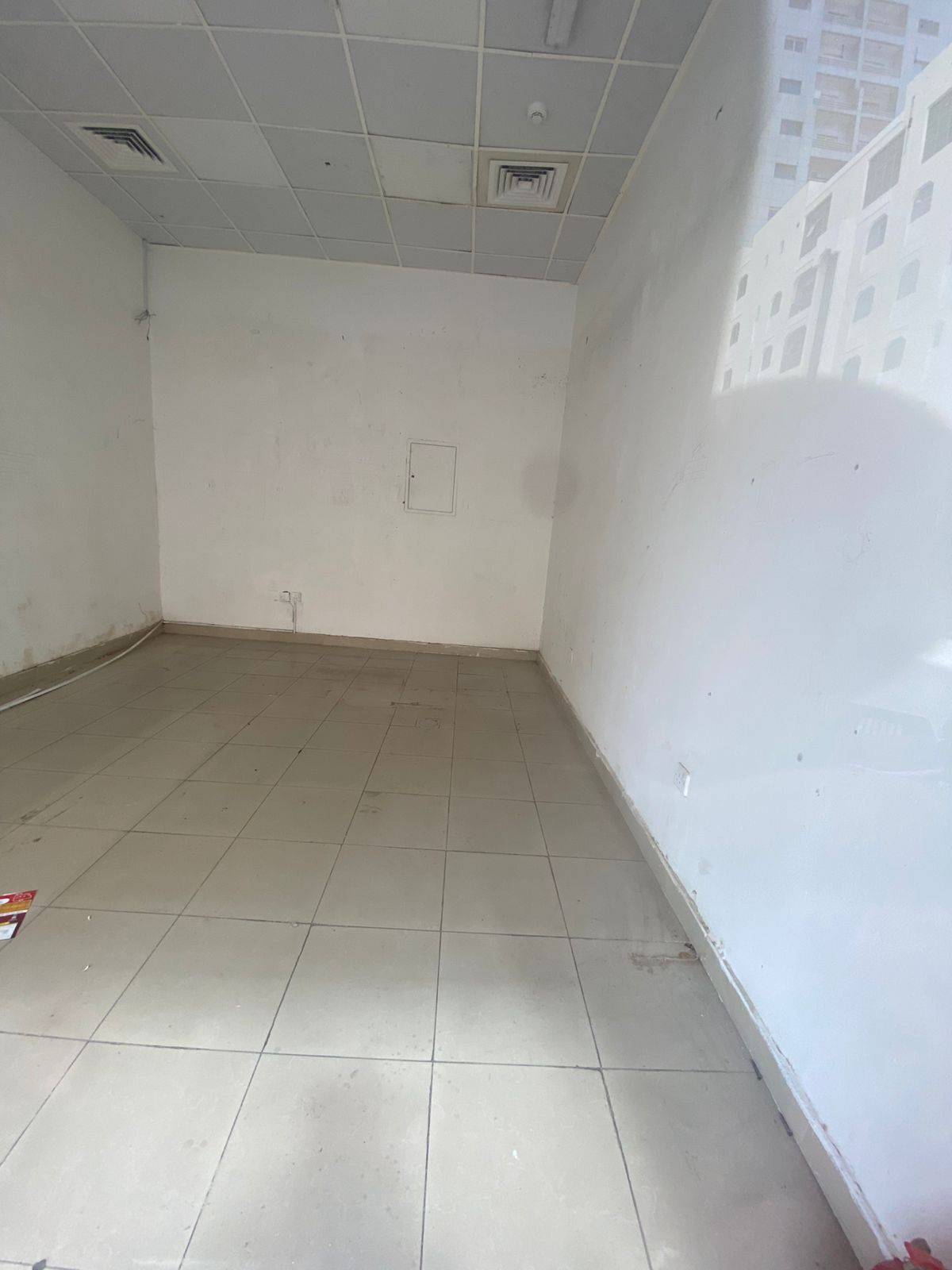 Shop for rent in Abu Shagara, prime active location, suitable for all business types, AED 28,000 yearly in 4 cheques, security deposit AED 2,000.