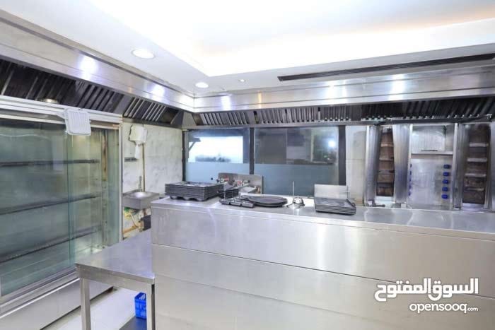 Restaurant for sale in Al Majaz 2, Sharjah, ready to operate with valid license and outdoor seating, annual rent AED 120,000, selling price AED 900,00