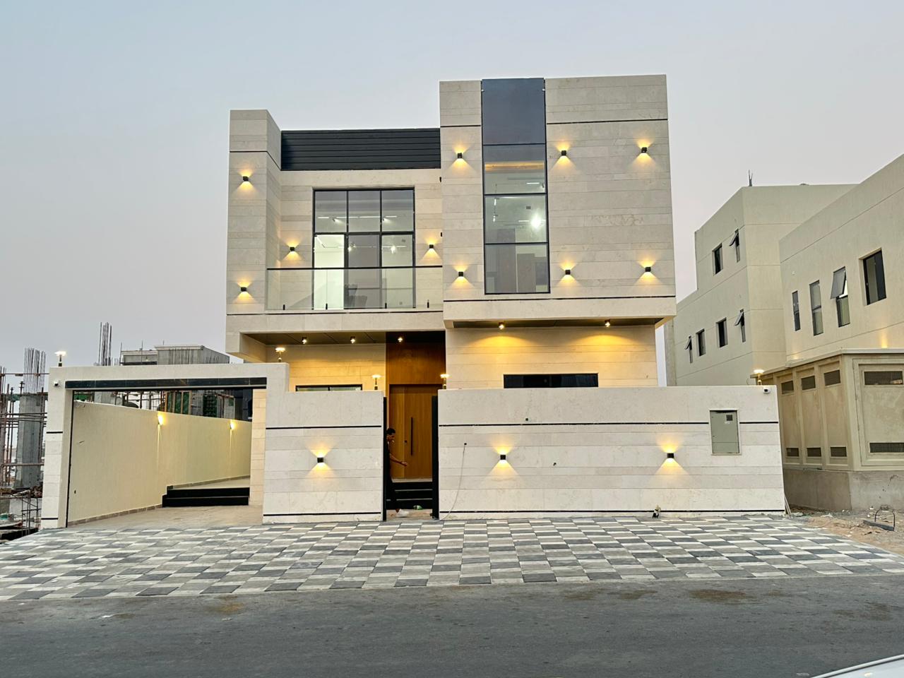 For sale: Modern villa with 5 master bedrooms, stone facade, in Al Zahia. Freehold ownership. Price includes registration fees.