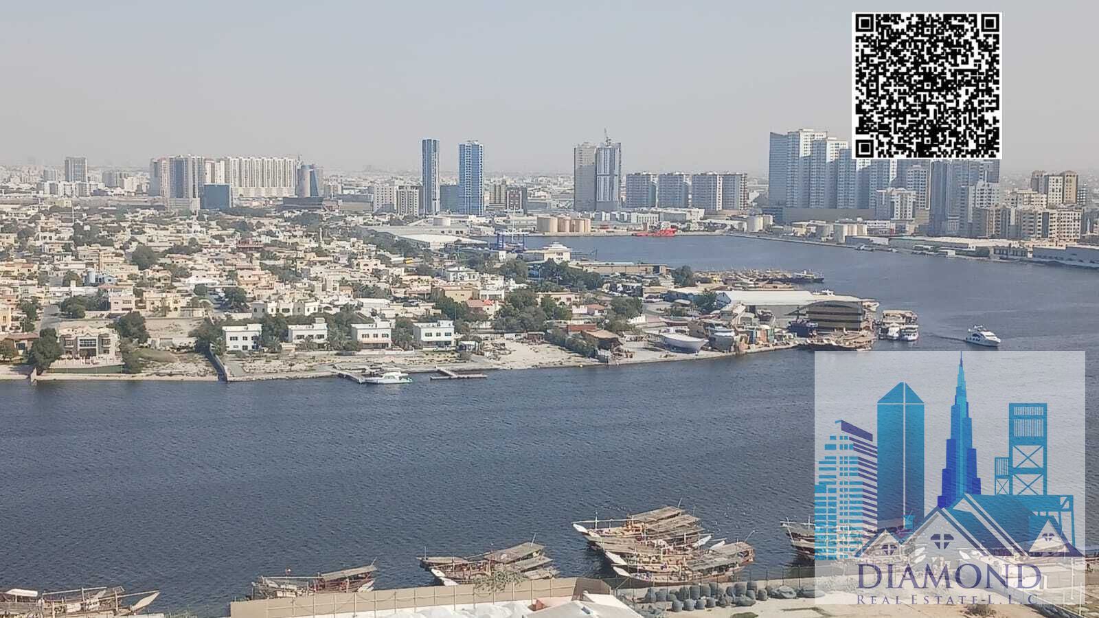 One-bedroom apartment with a living room, vacant, overlooking Ajman Creek, for sale in Orient Towers, freehold ownership, in the Emirate of Ajman.