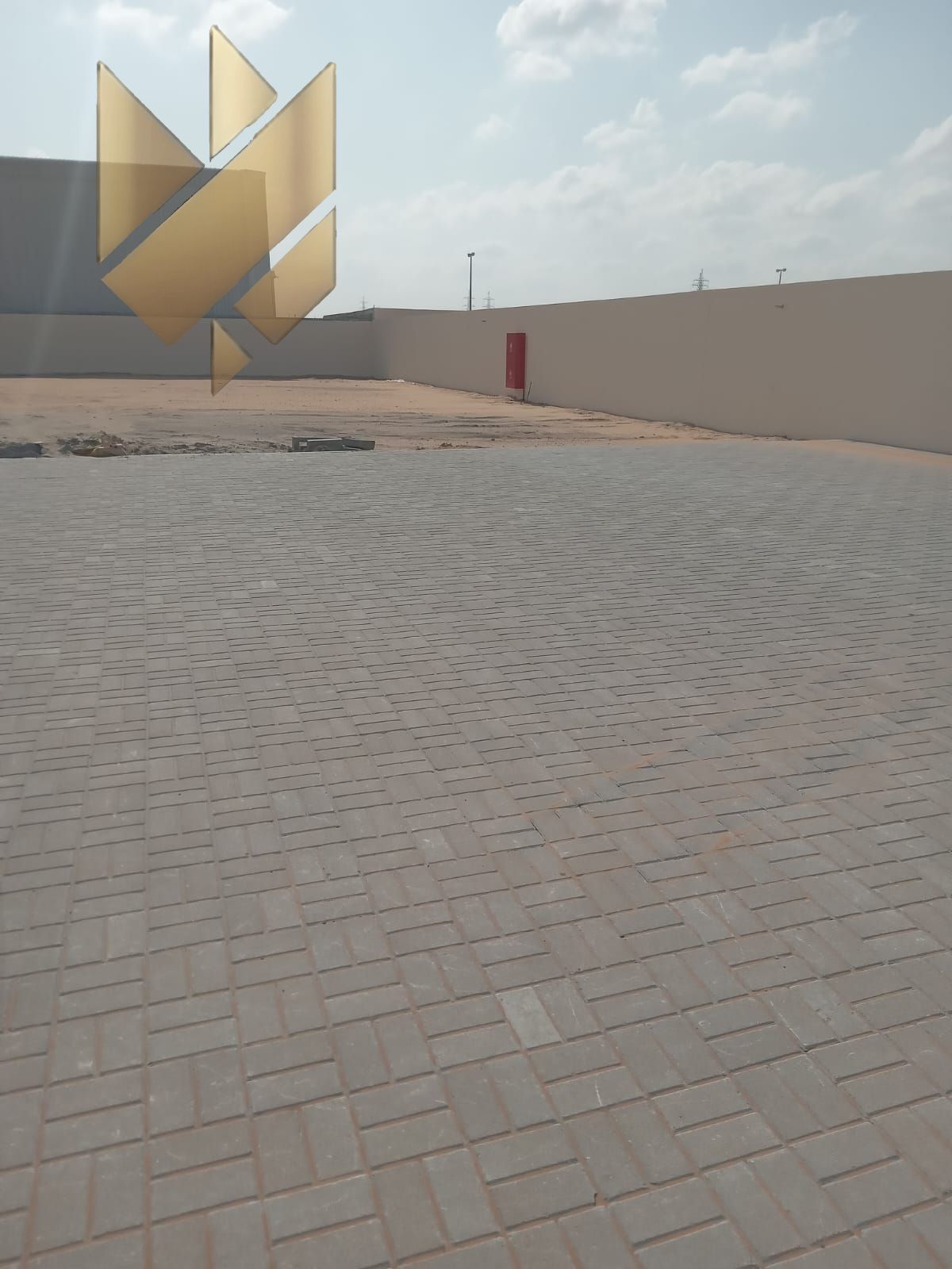 Brand-new yard for first use in Al Sajaa – Area 16,000 sqft – Standard electricity – Price AED 21 per sqft.