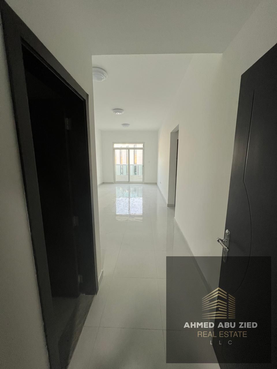 For annual rent: Spacious 3-bedroom apartment with living room and maid’s room in Corniche Ajman, 4 bathrooms, 2 balconies, free parking, central AC.