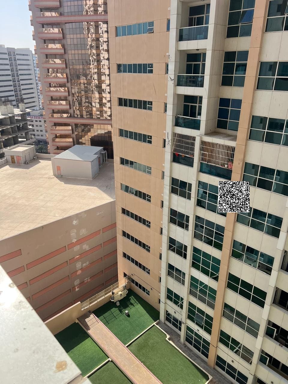 For annual rent in Ajman Towers, one apartment with two bedrooms a living room a balcony and parking.