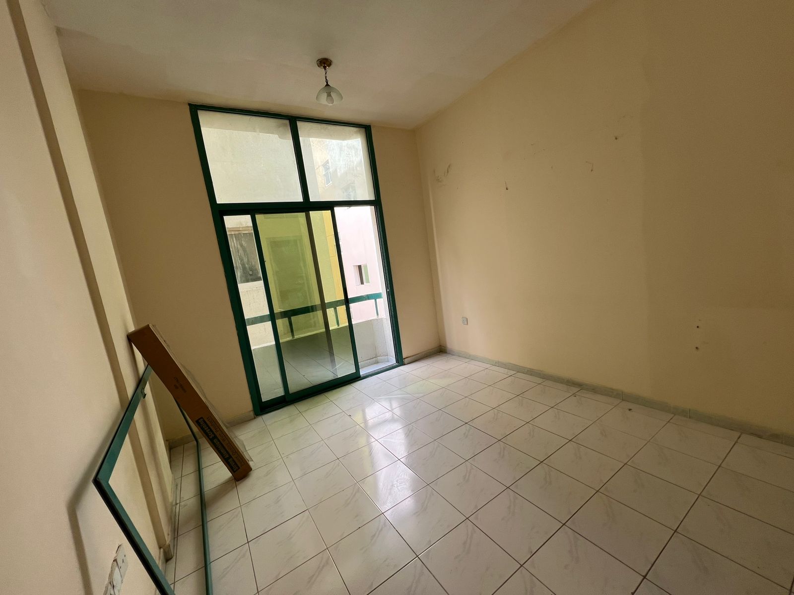 Cheapest apartment in Al Boutina – balcony – central AC – prime location – great price, only 25,000 AED.