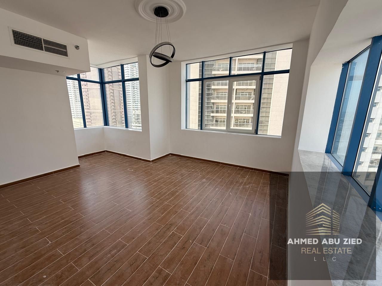 Two-bedroom apartment with a living room for annual rent in Al Nuaimiya 3, Ajman, with luxurious finishes, private parking, and a prime location close