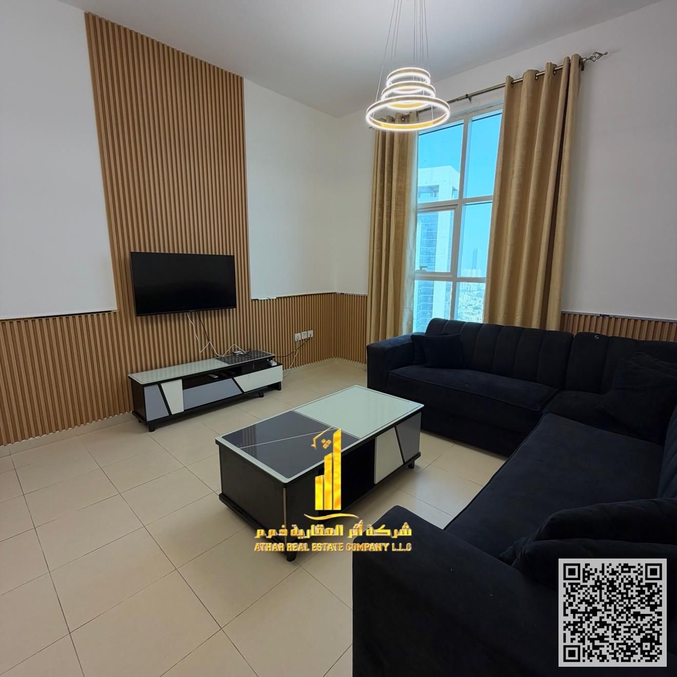 With an open view, a furnished two-bedroom apartment with a living room is available for monthly rent in Ajman Includes bills, internet, parking.