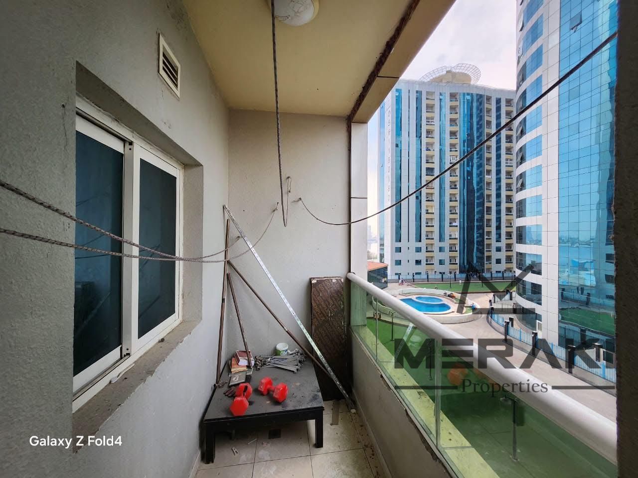 Apartment for Sale in Orient Towers Ajman Pool and Garden View Price AED 450,000