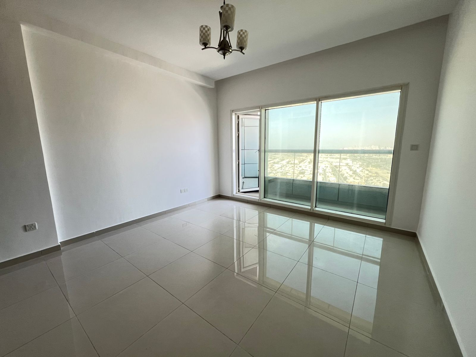 Two-bedroom apartment with living room for rent in Al Khan with parking, prime location near services.