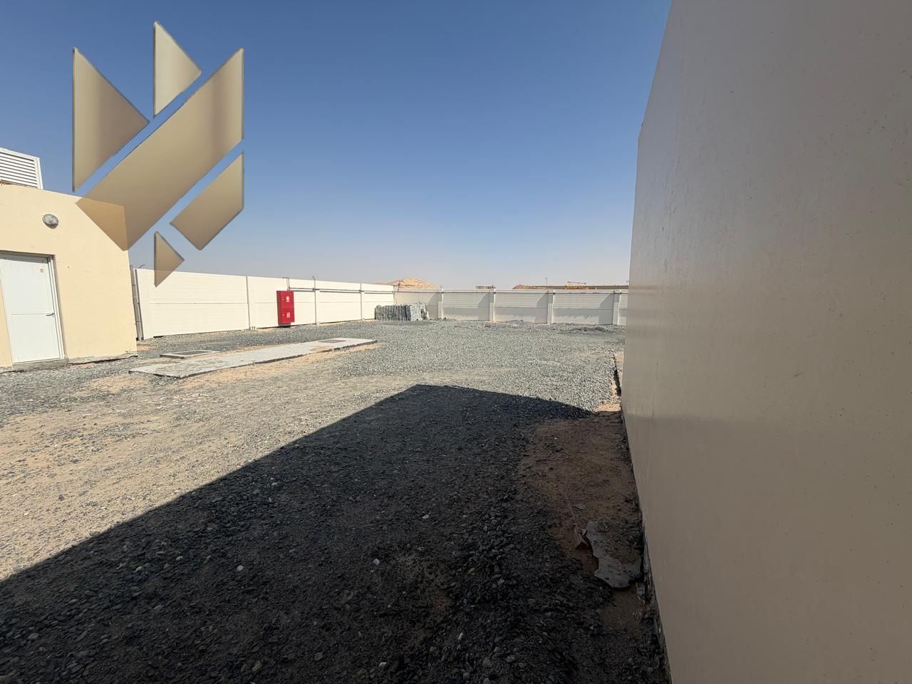 Open yard for rent in Al Sajaa, 5,500 sq. ft. with office, bathroom, and kitchen, AED 120K slightly negotiable, no security deposit.
