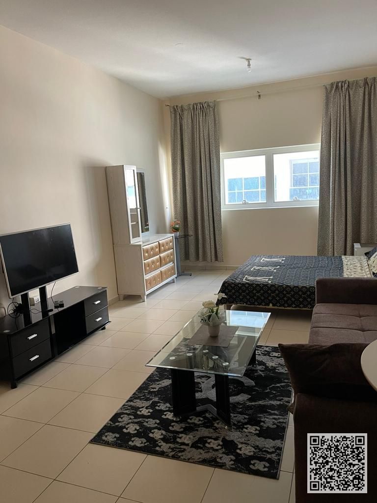 Furnished semi-detached kitchen studio apartment with hotel-style furnishings for monthly rent in Ajman - Al Rashidiya 3 - Ajman One Towers